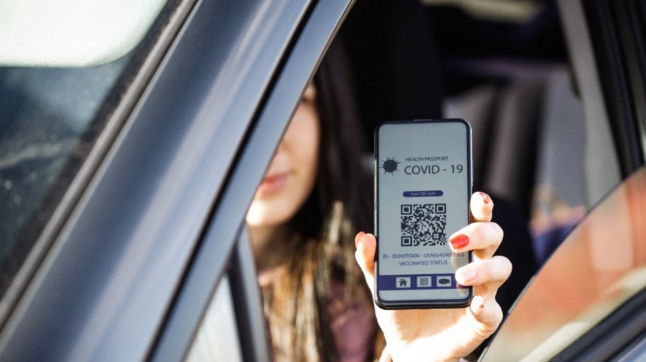 woman-car-covid-passport-gettyimages-lerexis