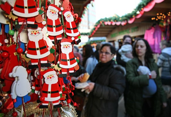 Santa ornaments for sale on display.