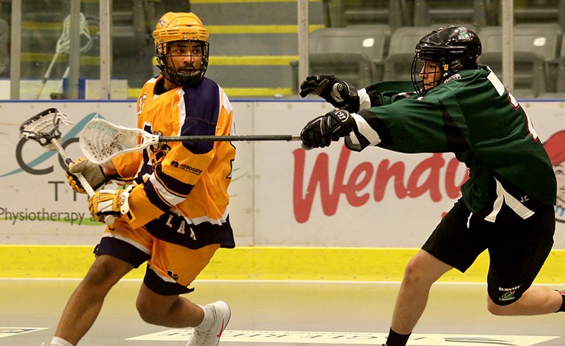 MARIO BARTEL/THE TRI-CITY NEWS
Coquitlam Adanacs forward Thomas Semple tries to escape the checking of Burnaby Lakers' defender Ethan Mclaren in the second period of their BC Junior A Lacrosse League game, Wednesday at the Poirier Sport and Leisure Complex. Semple scored three goals and added three assists in the Adanacs' 14-6 win.