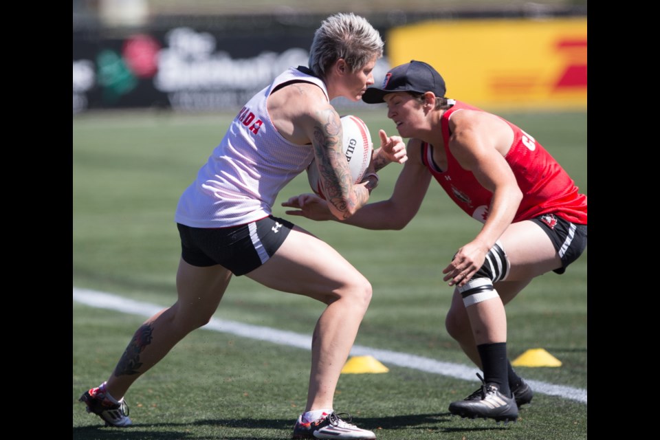 Jen Kish, left, and Brittany Benn practise with saʴý's women's sevens rugby team at Westhills Stadium. May 2017