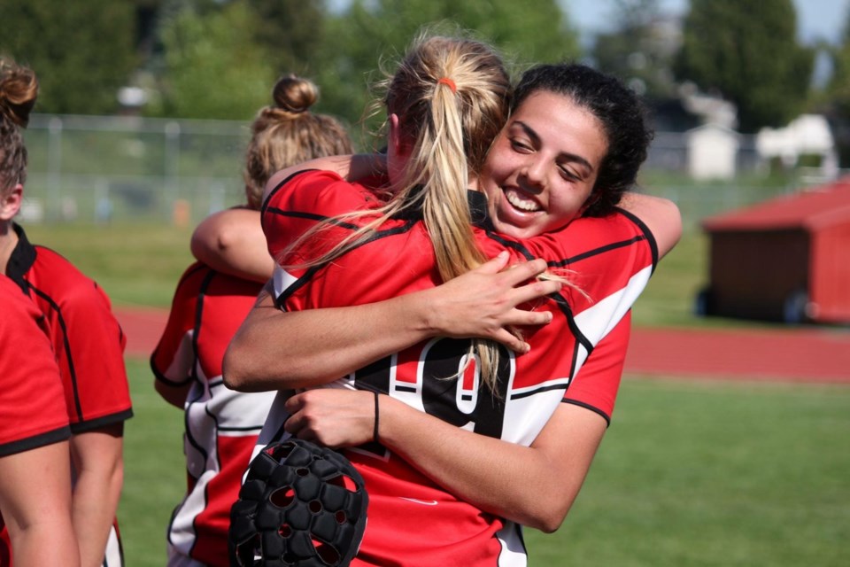 Carson Graham captains Lyric Atchison and Devan Baker embrace in celebration of a win over Yale in the senior girls provincial AAA rugby final played Saturday in Abbotsford. The win gave the Eagles their second straight B.C. title, and 10th of the past 13 years. photo supplied