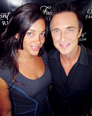 Marketer Veronica Bailey mugged with celebrated musician Colin James at Fairmont Pacific Rim Hotel's end of summer party.