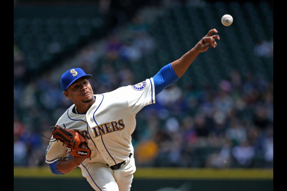 Seattle Mariners starting pitcher Ariel Miranda throws against the Tampa Bay Rays in the first inning of Sunday's game in Seattle.