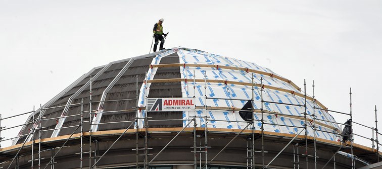 A worker from Admiral Roofing and Wall Systems works on the dome of the Prince George Law Courts Building. 
The dome is being replaced because it is at the end of its useful life and is being replaced with thicker copper sheeting expected to last 50 years. The insulation will be upgraded as well as part of the $300,000 project.
The work should be largely completed by July 31.
Citizen photo by Brent Braaten