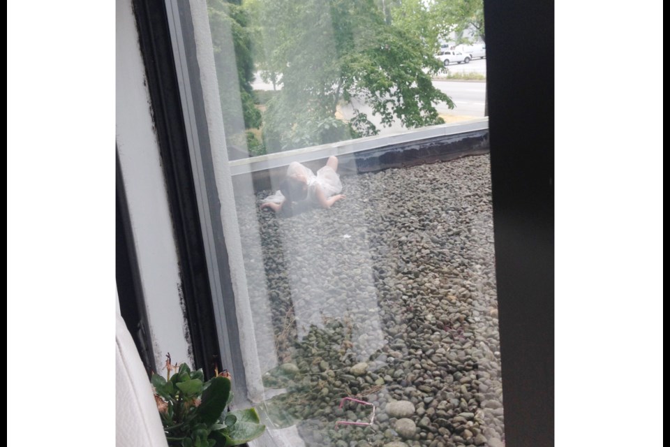 A photo taken from inside the second floor of the building shows the little girl moments after her dramatic plunge. Photo submitted by Victor Larichev