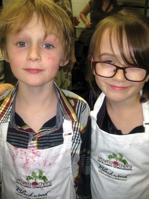 Budding chefs Max Redmond and Dixie Worland helped out at the Growing Chefs fundraiser held at the Pacific Institute of Culinary Arts.