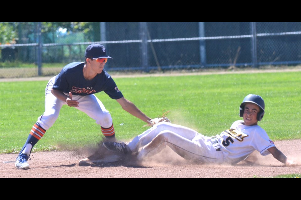 Richmond Chuckers’ Nathan Hikida looks for the umpire’s call after sliding into second base during action from Sunday’s B.C. Baseball 15U Bantam “AAA” provincial championship game at Blundell Park. The host Chuckers’ season ended with a silver medal after dropping a 5-2 decision to the Delta Tigers.