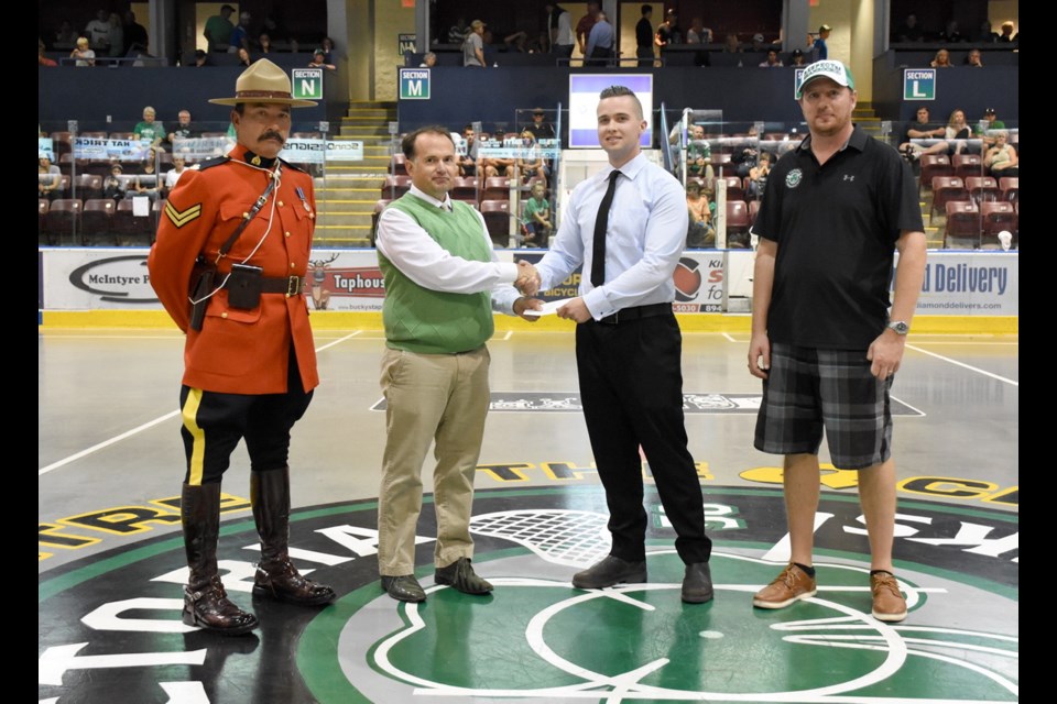 From left: RCMP Cpl. Heinz Krauss, Traffic Safety Commission chairman Colin Plant, scholarship recipient Tanner Stevenson and Shamrocks operations manager Jason Sperling.