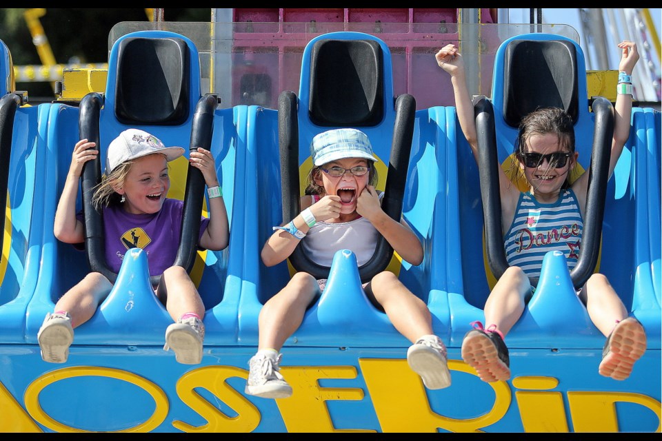 Mimi Burns, 6, left, Lily Burns, 8, and Niyah "B", 8, enjoy the Spring Ride during the 149th annual Saanich Fair at the Saanich Fairgrounds on Monday. The 2017 version of the annual event started on Saturday and concluded on Monday. Sept. 4, 2017