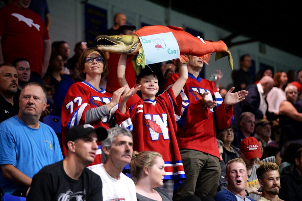 New Westminster lacrosse fans came out in droves, or is it schools, to welcome their WLA champions into Queen's Park Arena and cheer them on at the Mann Cup championships. Above, Tracy, Paul and 13-year-old David Horn wore the team colours proudly for Game 1 of the series.