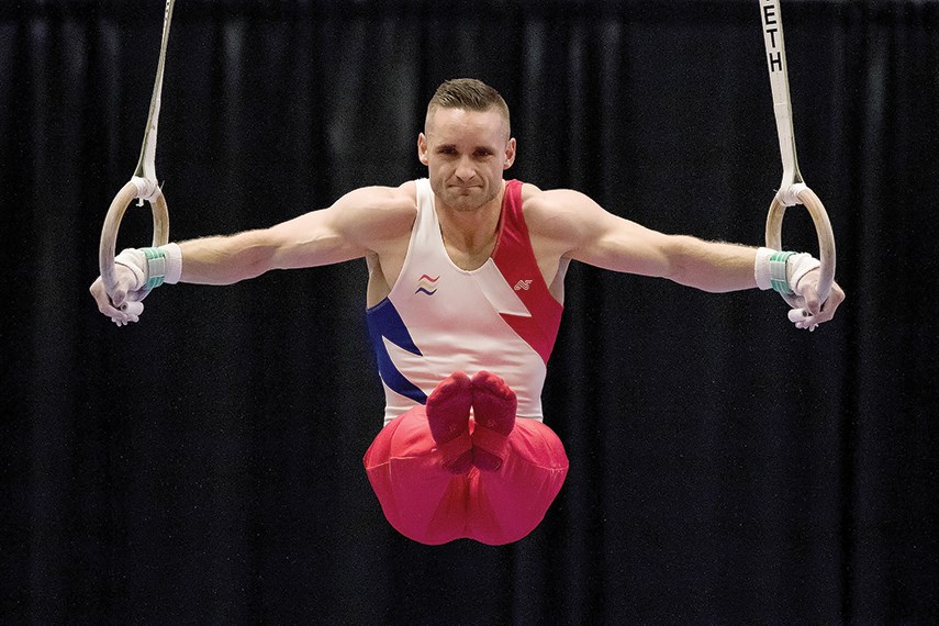 North Vancouver’s Scott Morgan powers through a routine on the rings during a recent competition. Morgan will compete with a heavy heart in this week’s World Gymnastics Championships in Montreal, less than three weeks after the passing of his father. photo supplied GCG/Amber Bracken