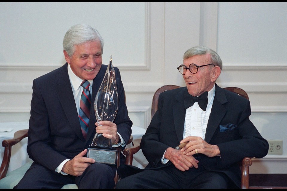 March 14, 1993: Monty Hall, left, laughs with George Burns after receiving the second annual George Burns Lifetime Award in Los Angeles.