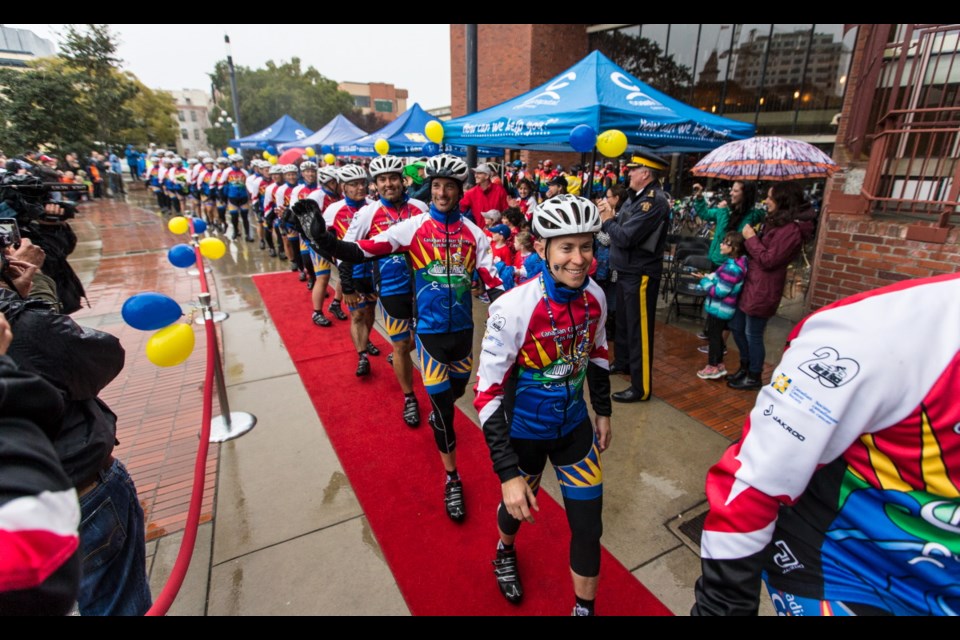 At end of gruelling 1,100 km journey, alumni join Tour de Rock cyclists