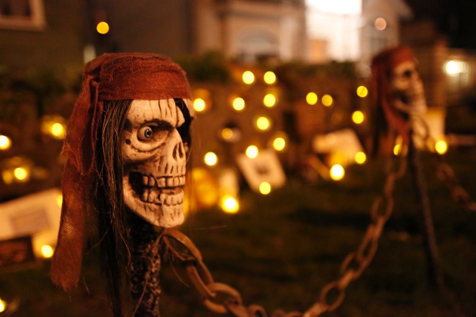 A pirate skull guards the shrine at night at Pirate House, an annual Halloween fundraiser in Burnaby.