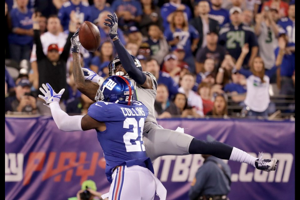 Seattle Seahawks' Paul Richardson, top, catches a touchdown over New York Giants' Landon Collins during the second half of Sunday's game in East Rutherford, N.J.