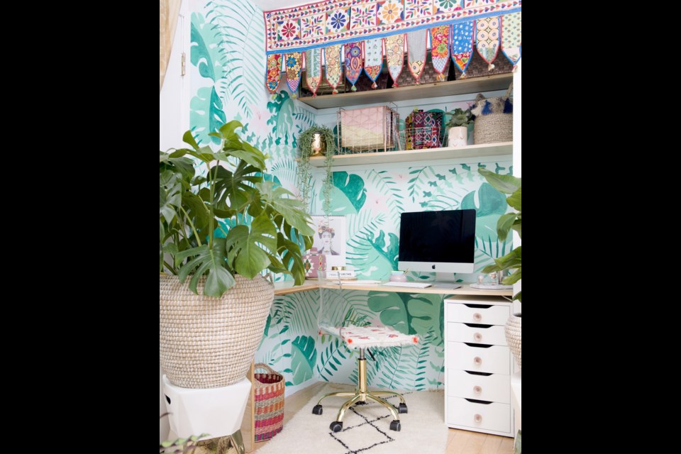 Anna Margaret&Otilde;s office was originally a cupboard. The wildly cheerful decorating, which includes walls hand-painted by her partner, is organized with baskets and drawers.