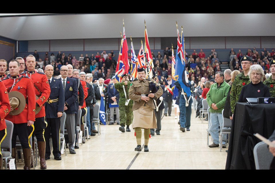 A piper leads in the Colour Party to begin Saturday’s Remembrance Day ceremony at the Prince George Civic Centre. Citizen Photo by James Doyle