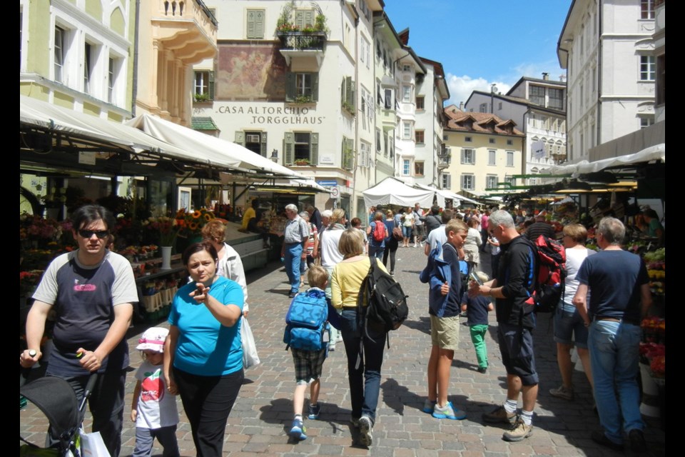 Produce market on Piazza Erbe in Bolzano. The South Tirol region of Italy has long been at one of Europe's main crossroads and a mixing bowl for Germanic and Italian cultures.