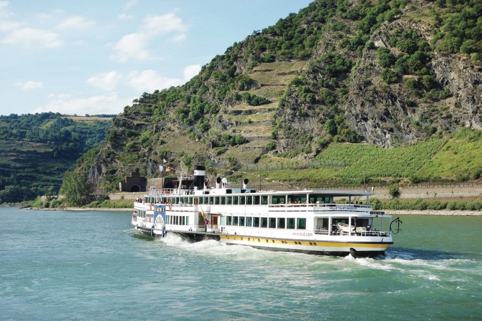 Riverboat on the Rhine River near the Loreley Cliffs, Oberwesel, Germany The Rhine River is best experienced from the deck of a relaxing riverboat, surrounded by the wonders of this romantic and historic gorge.