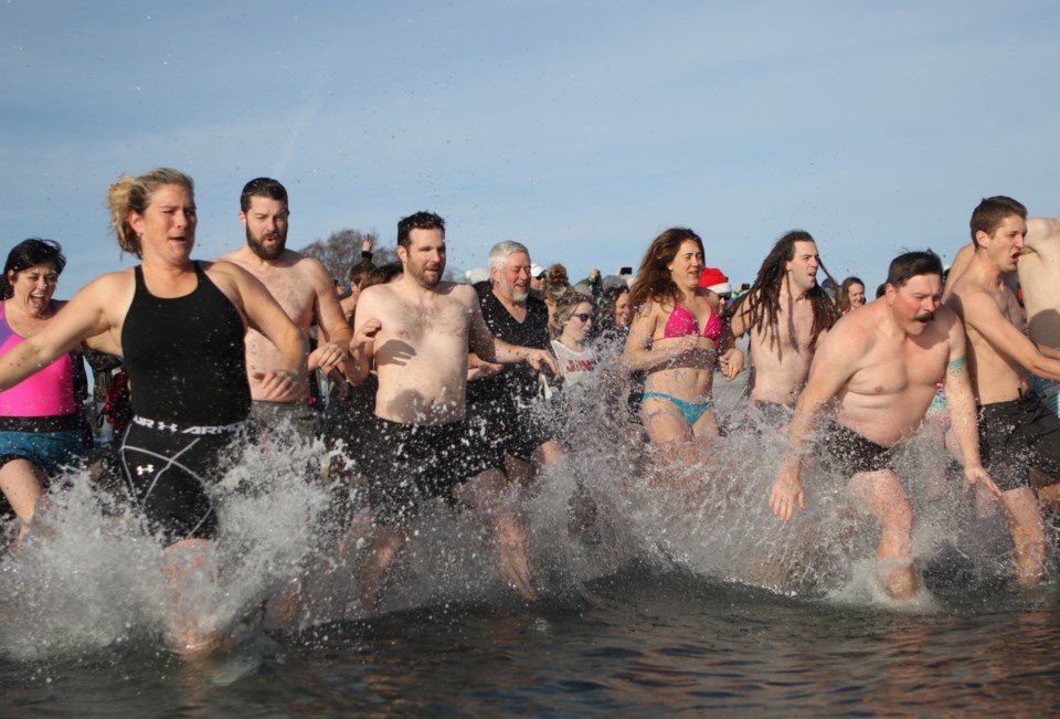 People take the plunge at Esquimalt Lagoon on New Year's Day