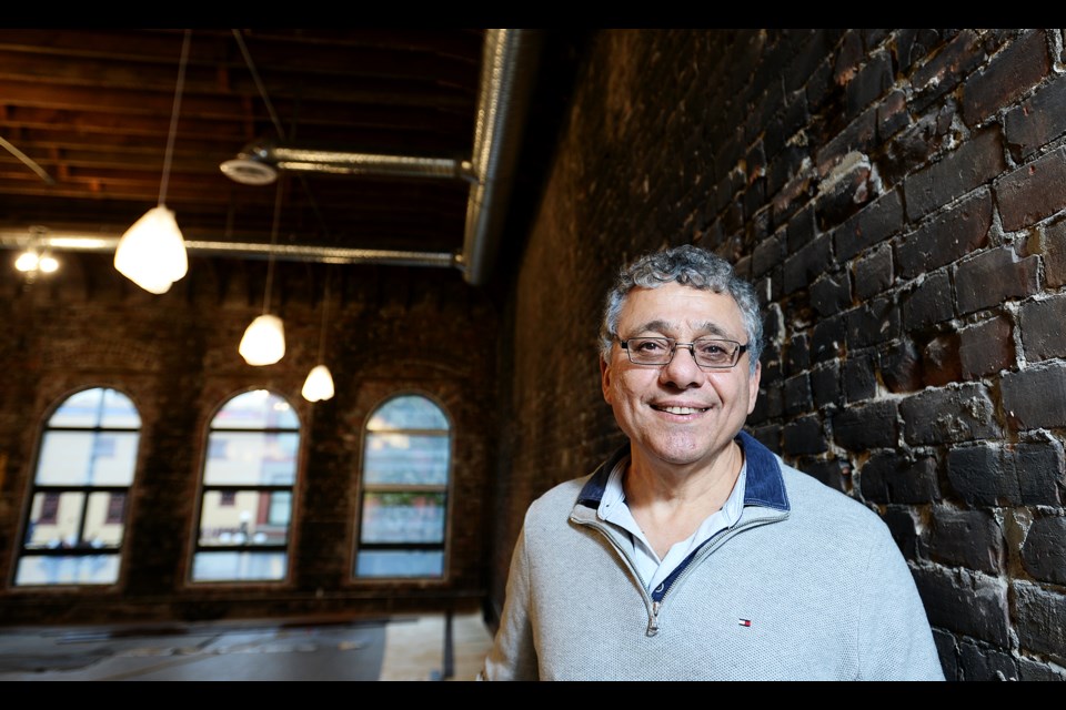 A labour of love: David Sarraf is thrilled with that the restoration of his building at 659 Columbia St. has revealed the building’s original arched windows and brick walls. Some of the red bricks show black from a fire in the building in 1968 – something he plans to preserve as its part of the 120-year-old building’s history.
