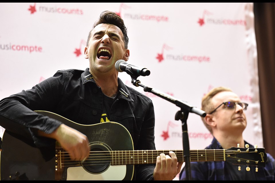 Hedley performed acoustically for students at Sir Alexander Mackenzie elementary on Tuesday. Photo Dan Toulgoet