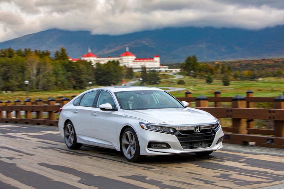 The new Accord sedan has an attractive fastback style with a sloping roofline tapering into the rear.