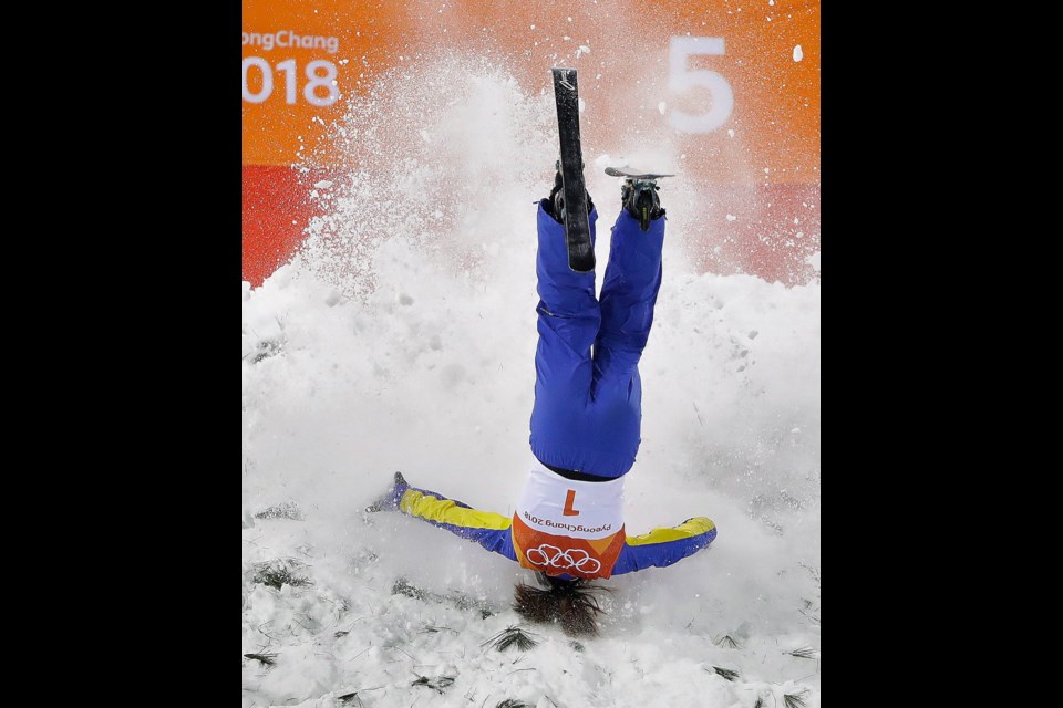 Xu Mengtao, of China, crashes during the women's freestyle aerial final at Phoenix Snow Park at the 2018 Winter Olympics in Pyeongchang, South Korea, Friday, Feb. 16, 2018.