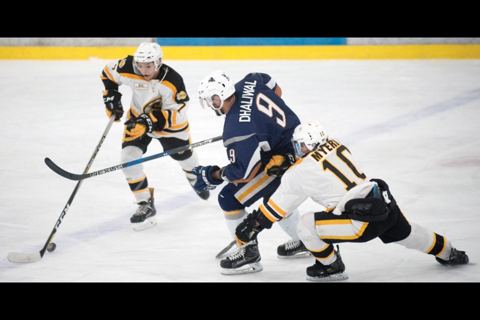 Gary Dhaliwal tries to work his way through a pair of Grandview Steelers during game four action on Sunday night at the Burnaby Winter Club. The Delta Ice Hawks captain capped a terrific series with the game-winning goal to complete a four-game sweep.