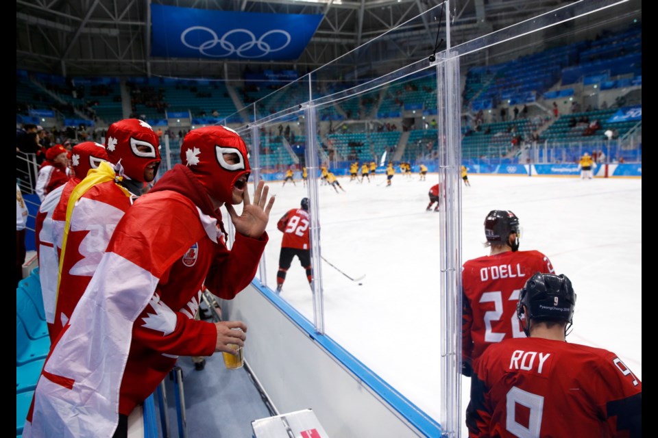 Fans cheer before the semifinal round of the men's hockey game between Germany and Canada at the 2018 Winter Olympics in Gangneung, South Korea, Friday, Feb. 23, 2018.