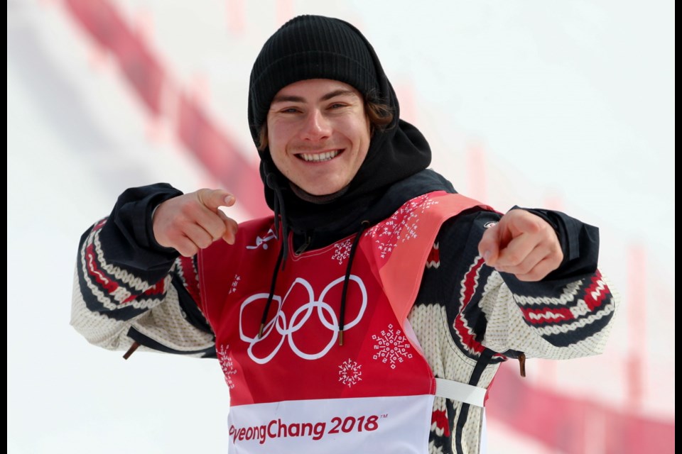 Sebastien Toutant, of saʴý, celebrates after winning the gold medal in the men's big air snowboard competition at the 2018 Winter Olympics in Pyeongchang, South Korea, Saturday, Feb. 24, 2018.