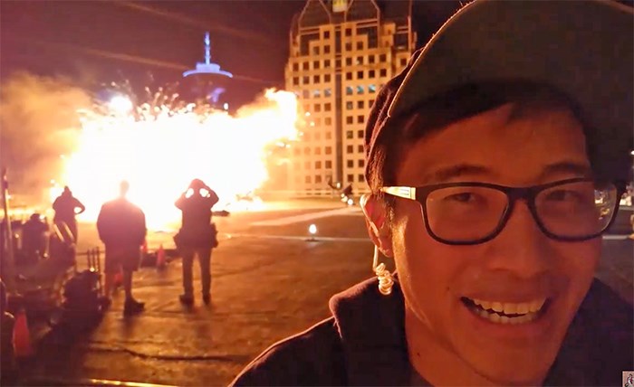 Milton Ng on set of The Arrow, adjacent the BC Hydro building downtown, with Harbour Centre also in