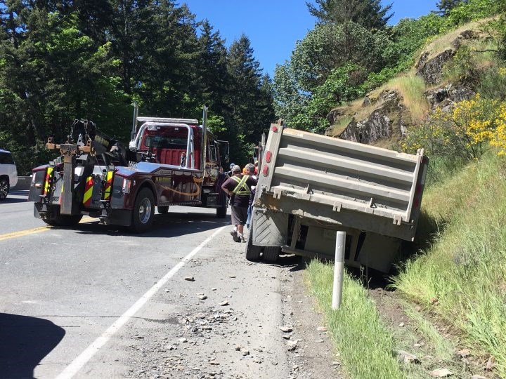 Dump truck hits rockface