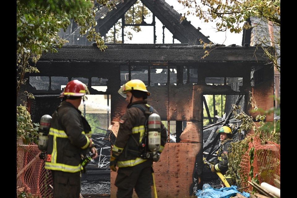 Prior Street is closed between Jackson and Gore avenues as firefighters respond to a three-alarm fire. Four homes were damaged in the blaze, with one almost completed gutted. Photo Dan Toulgoet