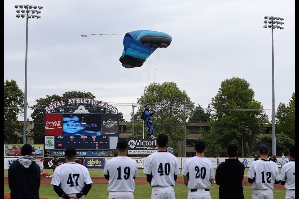 Parachuters deliver the game ball ahead of the season-opener between the Victoria HarbourCats and the Wenatchee AppleSox at Royal Athletic Park in Victoria on Friday, June 1, 2018.