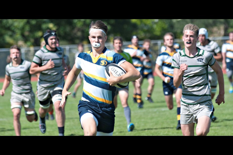 Grade 10 Ethan Troniak races in for a second half try in South Delta's 35-22 victory over Bateman in the provincial "AAA" tier one championship game on Saturday in Abbotsford. It's the Tsawwassen school's first-ever B.C. rugby title.