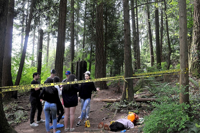 Heritage Woods Biology 12 and Law 12 students took part in a crime scene investigation project May 31 at the school and Bert Flinn Park. They worked in groups to stage a crime or accident scene and had to investigate one set up by their peers. The goal was to learn about investigation and analysis.