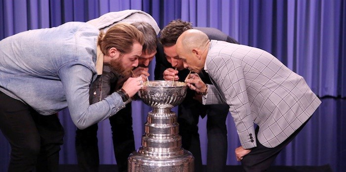 Jimmy Fallon, Alexander Ovechkin, Braden Holtby and jockey Mike Smith take a celebratory drink from