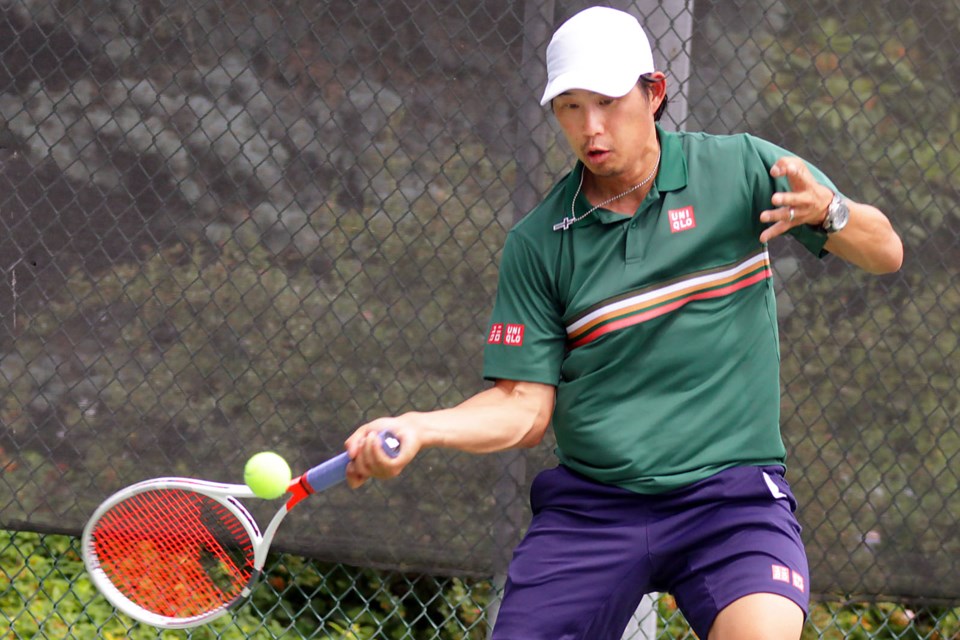 The action was hot and heavy at the Burnaby Tennis Open tournament over the past two weeks. Henry Choi sends a return shot in the men’s open division final on Sunday, where he prevailed 6-4, 6-2 over Carl Ho.