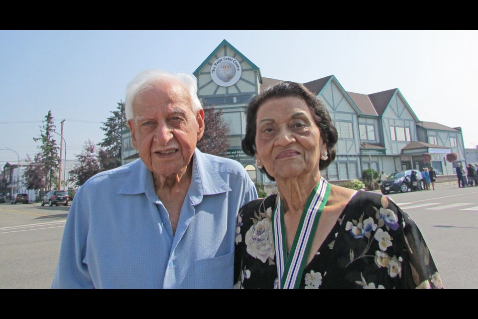 Bal and Baljit Sethi stand before the Immigrant and Multicultural Services Society building located at 1270 Second Ave., which will forever be known as the Baljit Sethi Centre to honour her years of dedicated service to the immigrants in the north.