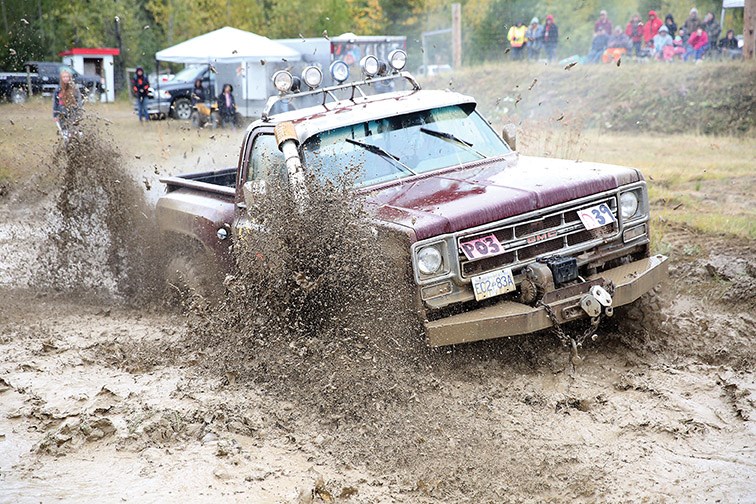 Mike Olin races his truck Swampin Tom through the mud pits on Saturday afternoon while competing in the first of two days of Mud Bogs at NITRO Motorsports Park. Citizen Photo by James Doyle