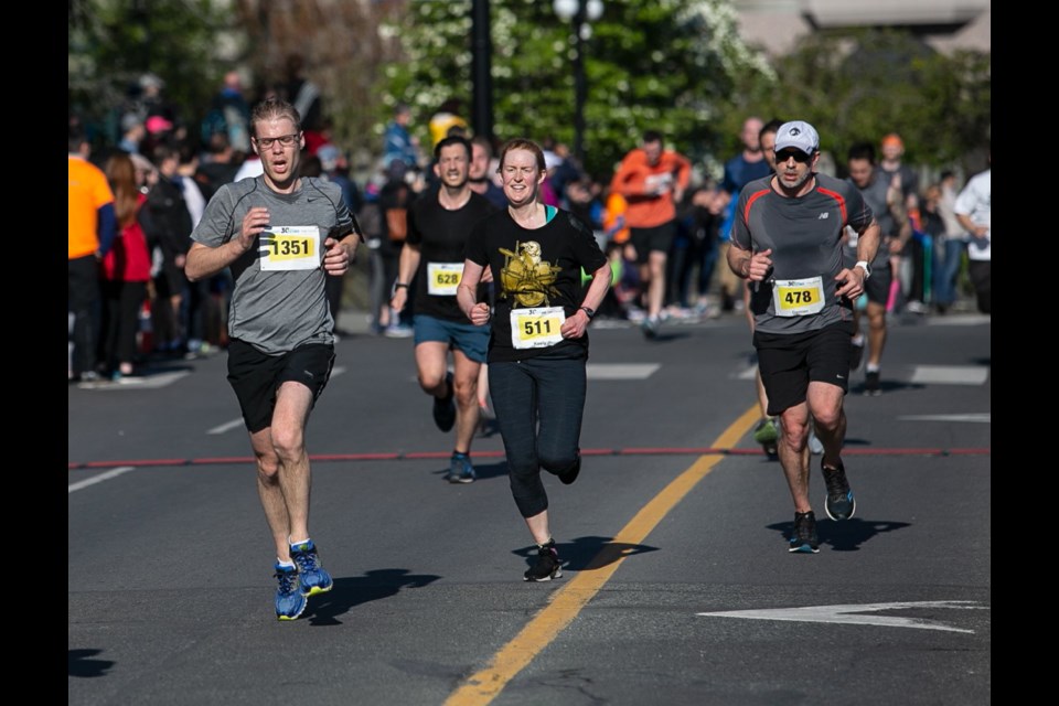 Runners approach the finish line of the saʴý 10K on Sunday. April 28, 2019