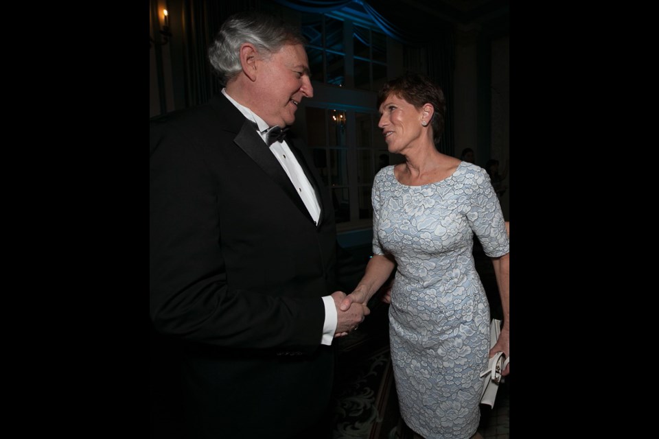 Saul Klein, dean of the Peter B. Gustavson School of Business, greets innovator and entrepreneur Sue Paish at the Distinguished Entrepreneur of the Year Award ceremony on Thursday night.