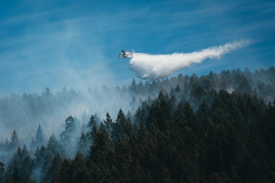 Aerial crews fight Pender Harbour fire on Tuesday.