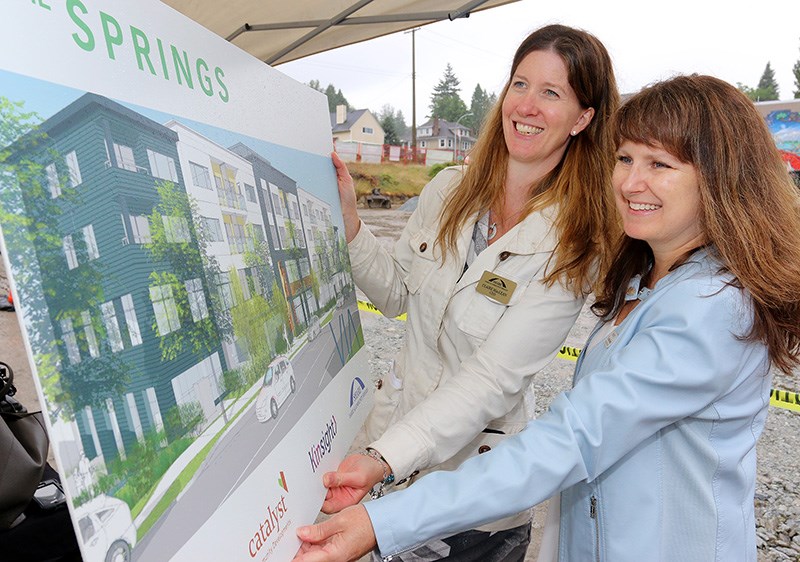 Christine Scott, CEO of Kinsight, and Claire MacLean, CEO of Share Family and Community Services, check out the plans for The Springs, a joint project by the two agencies plus St. Andrews-Ioco united Church and Catalyst Community Developments Society to build 55 units of affordable housing on the church property. It will also include the new Tri-Cities Children’s Centre, which will provide services and programming for families of children with developmental delays and disabilities.