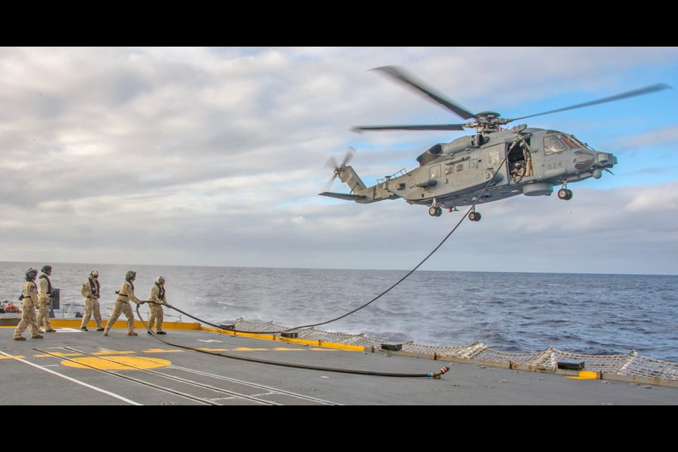 HMCS Regina&rsquo;s air detachment and the CH-148 helicopter Bronco train on hoisting and in air refuelling in the Pacific Ocean during Operation Projection on Aug. 2.