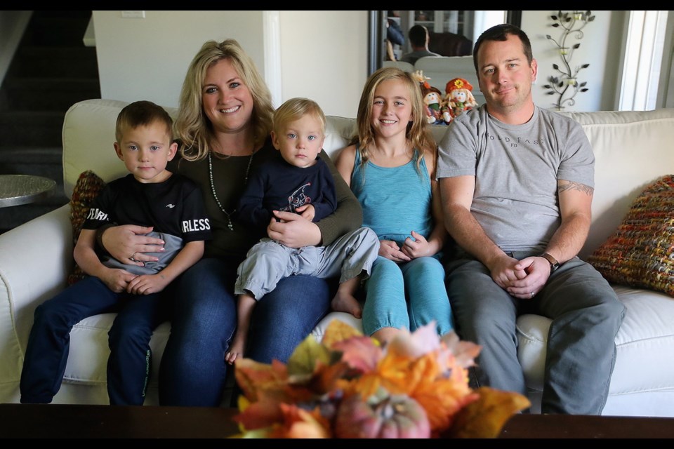 The Simpson family are one of many families affected by the strike in the Saanich school district. Michael and Farrah Simpson with their children, from left, Levi, 6, Beau, 2, and Kaycee, 8, at their home in Central Saanich.