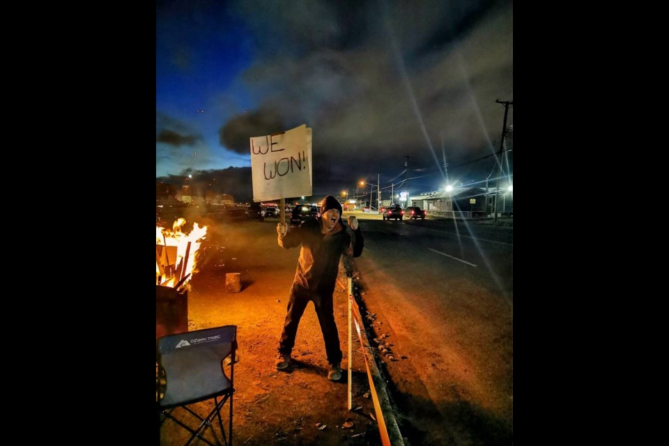 CN Rail conductor Julian Massini expresses his sentiments on the picket line along First Avenue after getting news Tuesday morning that the week-long strike is over, pending ratification of a tentative settlement.