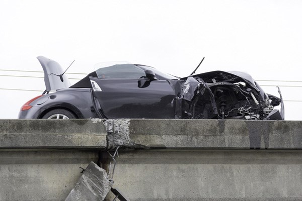 Steveston Highway and a southbound lane on Highway 99 near the Massey Tunnel had to be closed Monday afternoon after a car lost control and knocked off a guard rail on the Steveston Highway overpass.