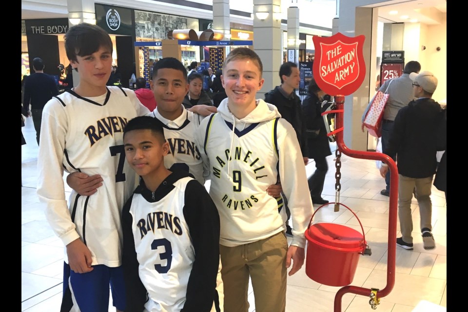 MacNeill Ravens basketball players were at Richmond Centre last weekend helping out with the Salvation Army Kettle Campaign.